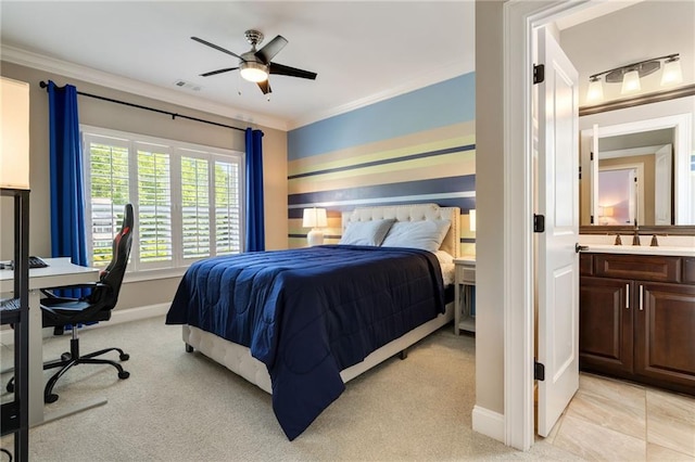 bedroom featuring crown molding, light carpet, a sink, baseboards, and visible vents
