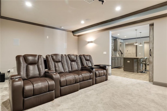cinema room featuring baseboards, ornamental molding, and recessed lighting