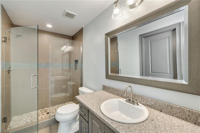 full bath featuring vanity, toilet, recessed lighting, a shower stall, and visible vents