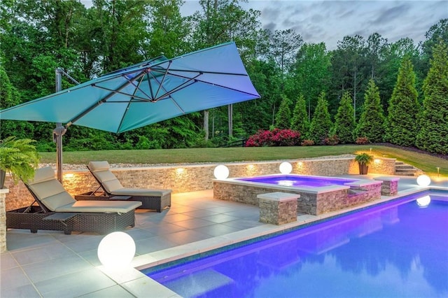 outdoor pool featuring a patio and an in ground hot tub