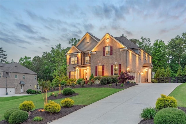 view of front of home featuring fence, an attached garage, concrete driveway, and a front lawn