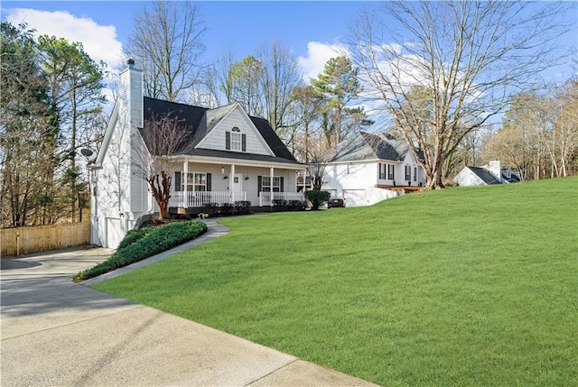 cape cod-style house with a front yard and a porch