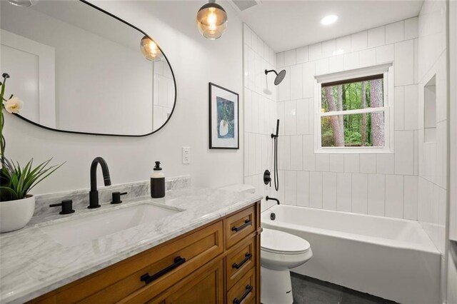 full bathroom featuring toilet, vanity, shower / bathtub combination, and recessed lighting