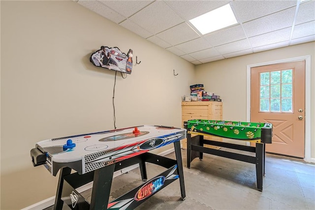 45 Chestatee River Rdg NE, Dahlonega, GA 30533 - recreation room featuring a paneled ceiling, concrete floors, and baseboards