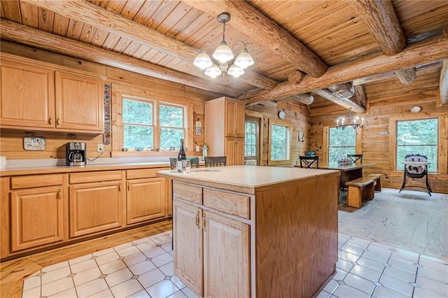 45 Chestatee River Rdg NE, Dahlonega, GA 30533 - kitchen with wood ceiling with exposed beams, a chandelier, plenty of natural light, wooden walls, and light countertops