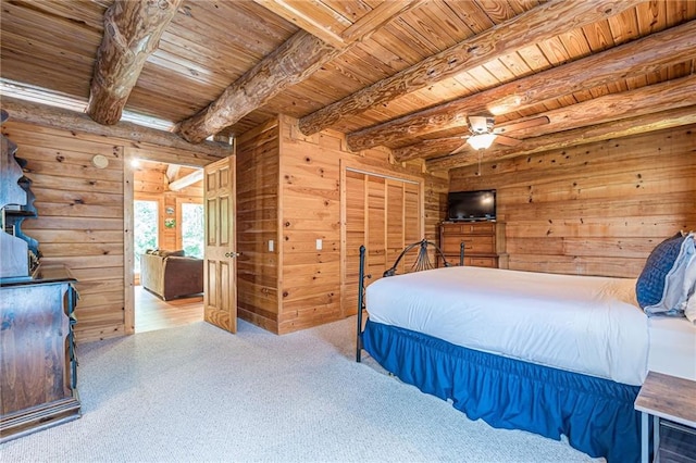 45 Chestatee River Rdg NE, Dahlonega, GA 30533 - bedroom featuring wooden ceiling with exposed beams, wood walls, a wood stove, and a ceiling fan