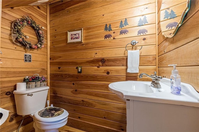 45 Chestatee River Rdg NE, Dahlonega, GA 30533 - half bathroom featuring wood walls, vanity, and toilet