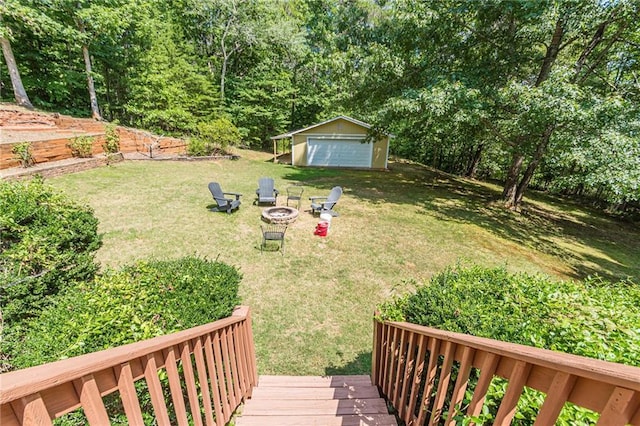 45 Chestatee River Rdg NE, Dahlonega, GA 30533 - view of green lawn featuring an outdoor structure, a fire pit, and a garage