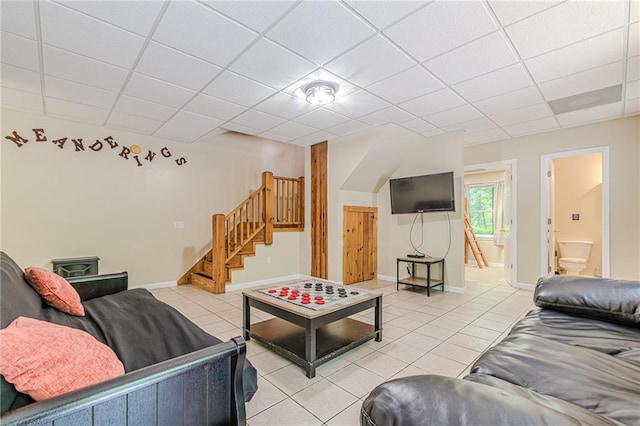 45 Chestatee River Rdg NE, Dahlonega, GA 30533 - living room featuring light tile patterned flooring, stairs, a drop ceiling, and baseboards