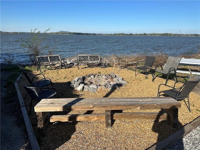 water view with a fire pit