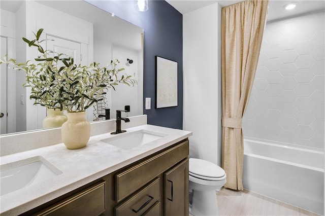 full bathroom with toilet, vanity, and shower / bath combo