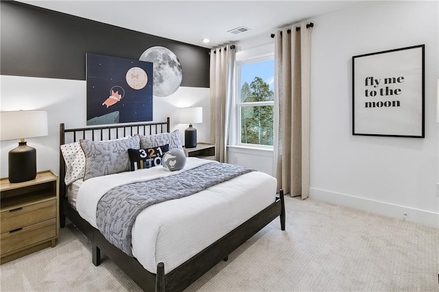 bedroom featuring light colored carpet