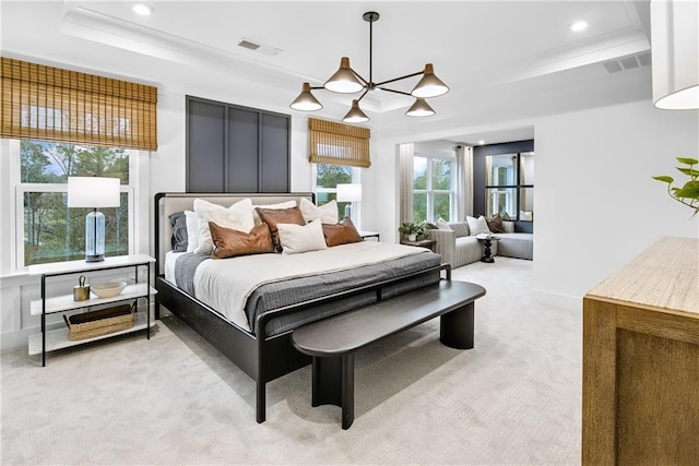 carpeted bedroom with a raised ceiling and a notable chandelier