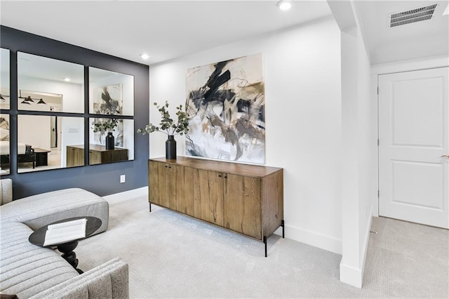 home office with ceiling fan and light carpet