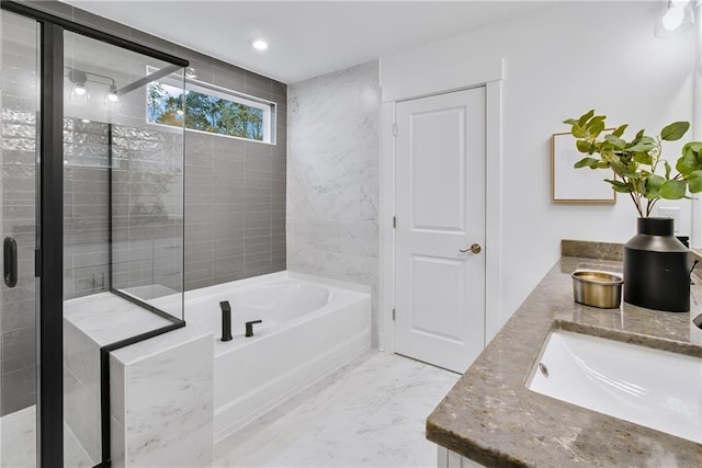 bathroom featuring independent shower and bath and vanity