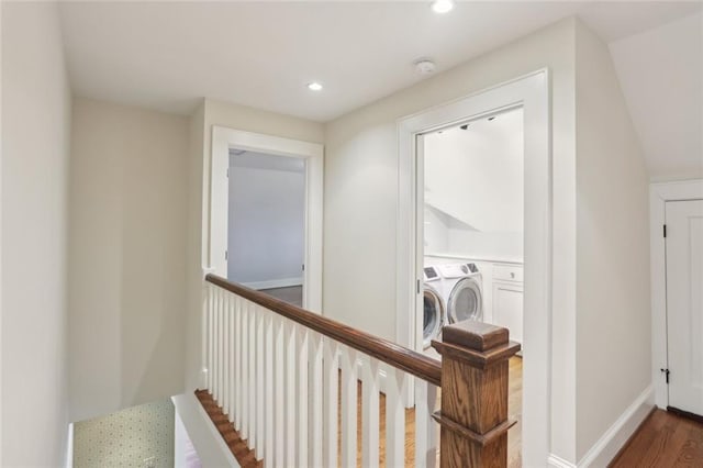 washroom featuring washing machine and dryer, recessed lighting, and wood finished floors