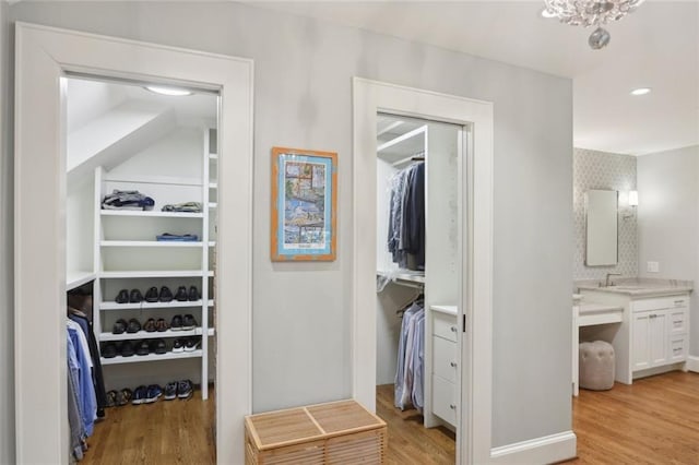 spacious closet featuring light wood-type flooring