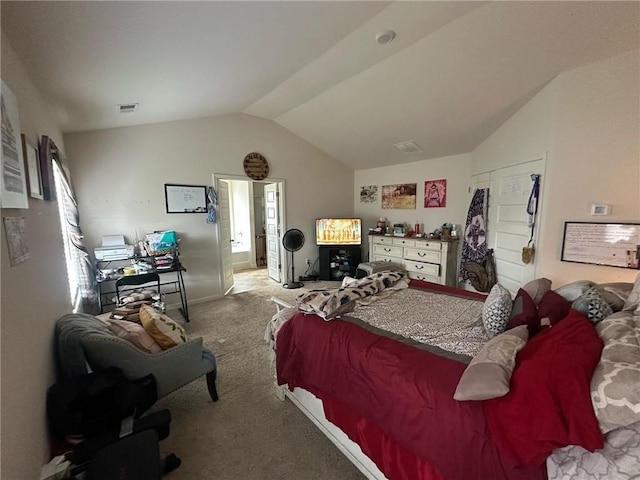 carpeted bedroom with vaulted ceiling