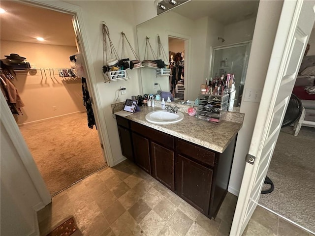 bathroom featuring vanity and walk in shower