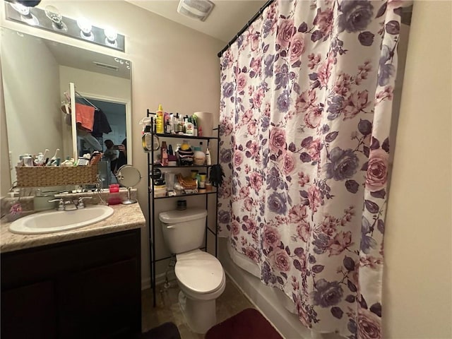 full bathroom featuring vanity, shower / bath combination with curtain, and toilet