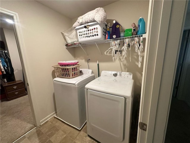 washroom featuring carpet and washer and dryer