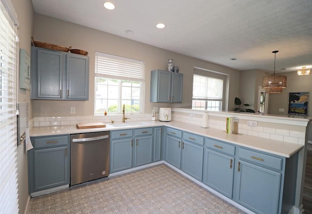 kitchen featuring a sink, light countertops, dishwasher, recessed lighting, and a peninsula