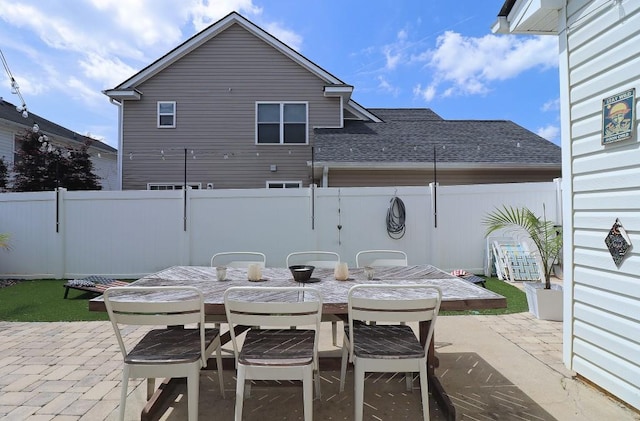 view of patio / terrace featuring outdoor dining space and a fenced backyard