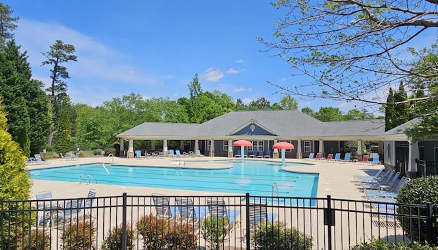 pool featuring a patio and fence