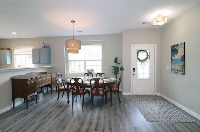 dining area with recessed lighting, visible vents, wood finished floors, and baseboards