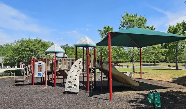 community jungle gym featuring a yard