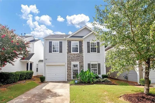 view of front of house featuring a garage and a front lawn