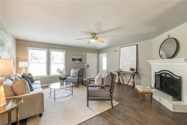 4408 Brandon Ct NE, Marietta, GA 30066 - living room with healthy amount of natural light, a fireplace, ceiling fan, and wood finished floors