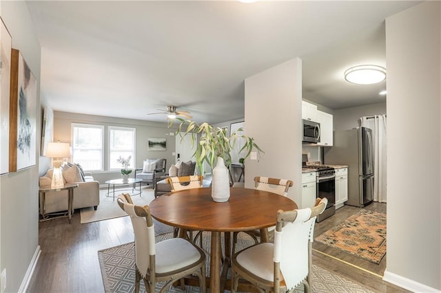 4408 Brandon Ct NE, Marietta, GA 30066 - dining area with a ceiling fan, wood finished floors, and baseboards