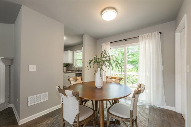 4408 Brandon Ct NE, Marietta, GA 30066 - dining room featuring dark wood finished floors and baseboards