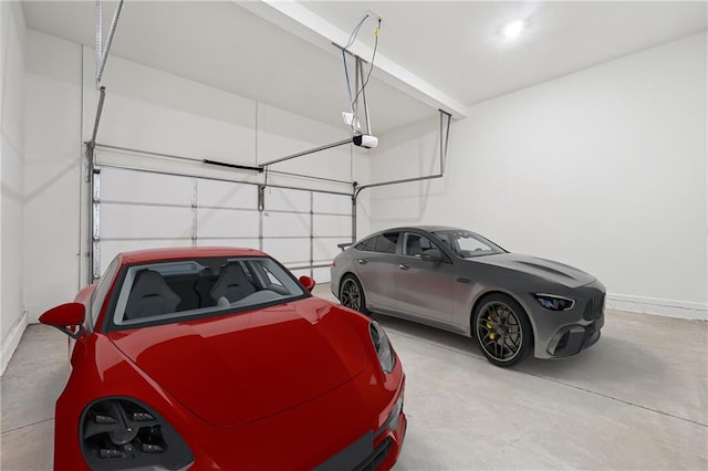 784 Keystone Dr, Woodstock, GA 30188 - garage with a garage door opener and baseboards