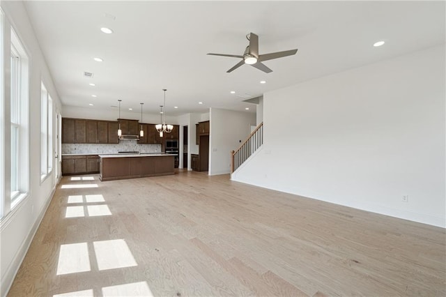 784 Keystone Dr, Woodstock, GA 30188 - unfurnished living room with light wood-style floors, plenty of natural light, recessed lighting, and a ceiling fan