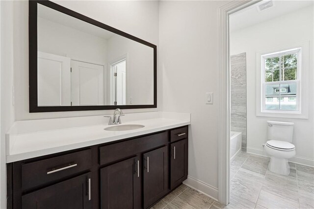 784 Keystone Dr, Woodstock, GA 30188 - bathroom featuring vanity, toilet, and baseboards