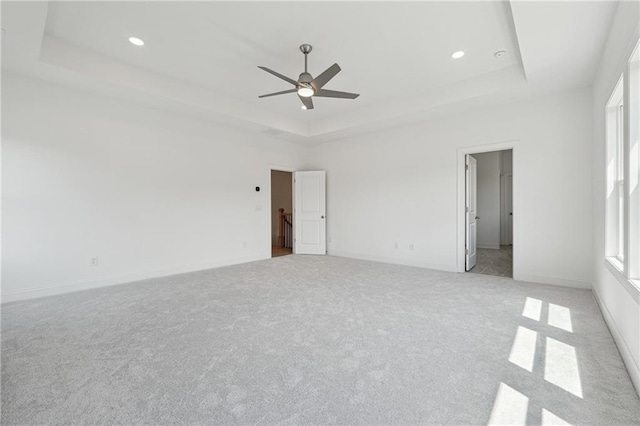 784 Keystone Dr, Woodstock, GA 30188 - empty room featuring a tray ceiling, light carpet, a ceiling fan, recessed lighting, and baseboards