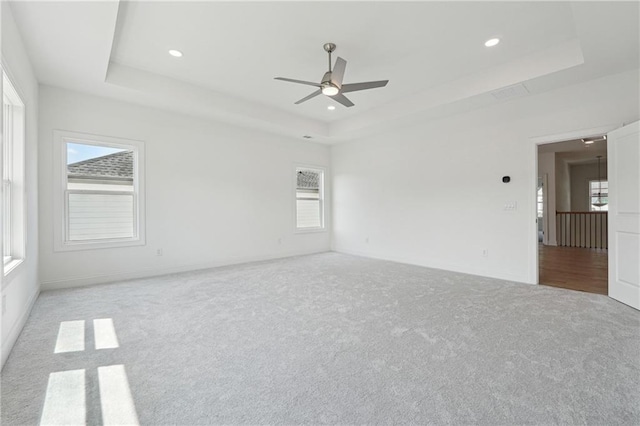 784 Keystone Dr, Woodstock, GA 30188 - carpeted empty room with a tray ceiling, a ceiling fan, recessed lighting, and baseboards