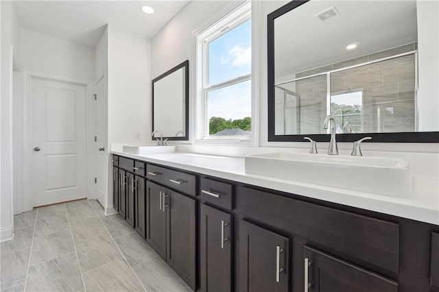 784 Keystone Dr, Woodstock, GA 30188 - bathroom with a stall shower, double vanity, marble finish floors, and recessed lighting