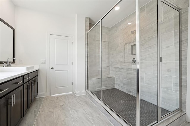 784 Keystone Dr, Woodstock, GA 30188 - bathroom featuring a stall shower, vanity, recessed lighting, and baseboards