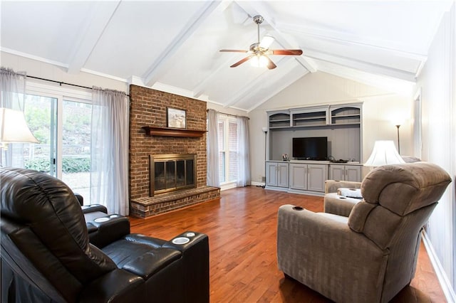 living room featuring lofted ceiling with beams, ceiling fan, a fireplace, and dark hardwood / wood-style flooring