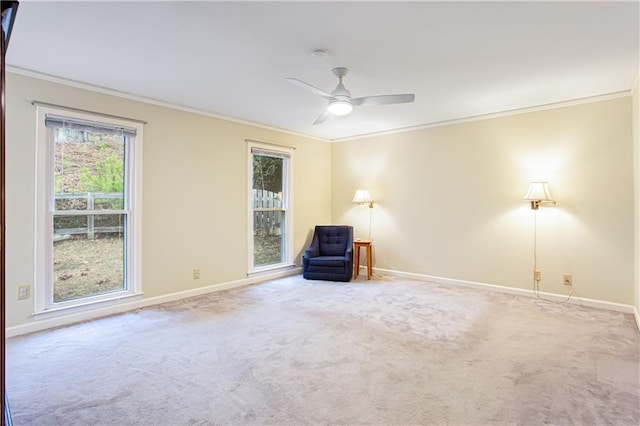 unfurnished room with ceiling fan, ornamental molding, and carpet floors