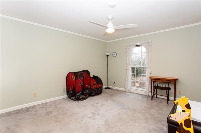 living area featuring crown molding, ceiling fan, and carpet flooring