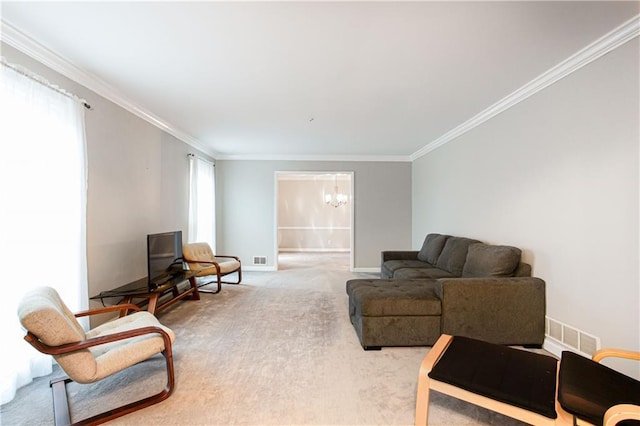 living room featuring crown molding, a chandelier, and carpet