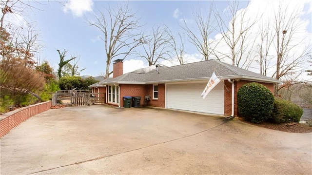 view of side of property with a garage