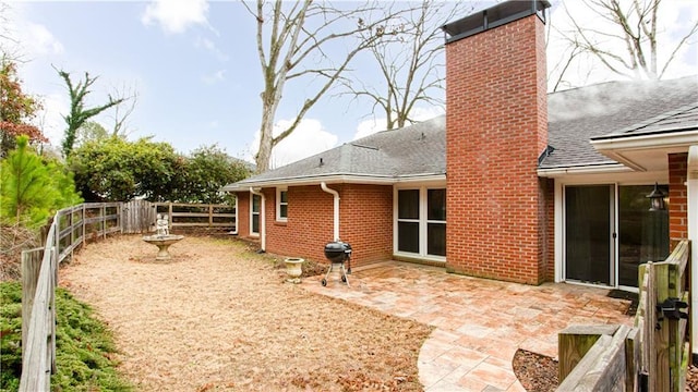 rear view of house featuring a patio