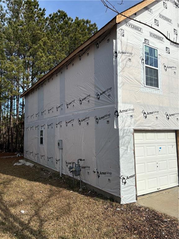 view of side of home with a garage