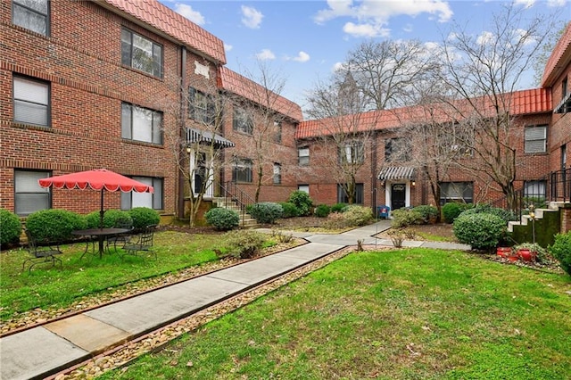 view of property's community with a yard