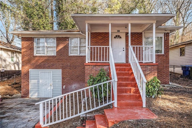 view of front of house with a garage and a porch